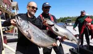 fish-18 Two men show off their King salmon catch