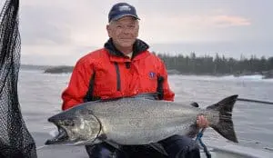 fish-21 A man poses with his Chinook salmon catch
