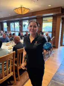 Torianne showcasing the Islander fishing rod and reel auctioned off to support the Heiltsuk Mens Wellness group