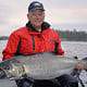 A man poses with his Chinook salmon catch