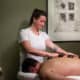 Masseuse servicing a client at Pacific King Lodge